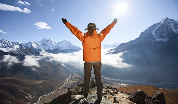 woman-looking-through-binoculars-at-pumori-in-mount-everest-nati